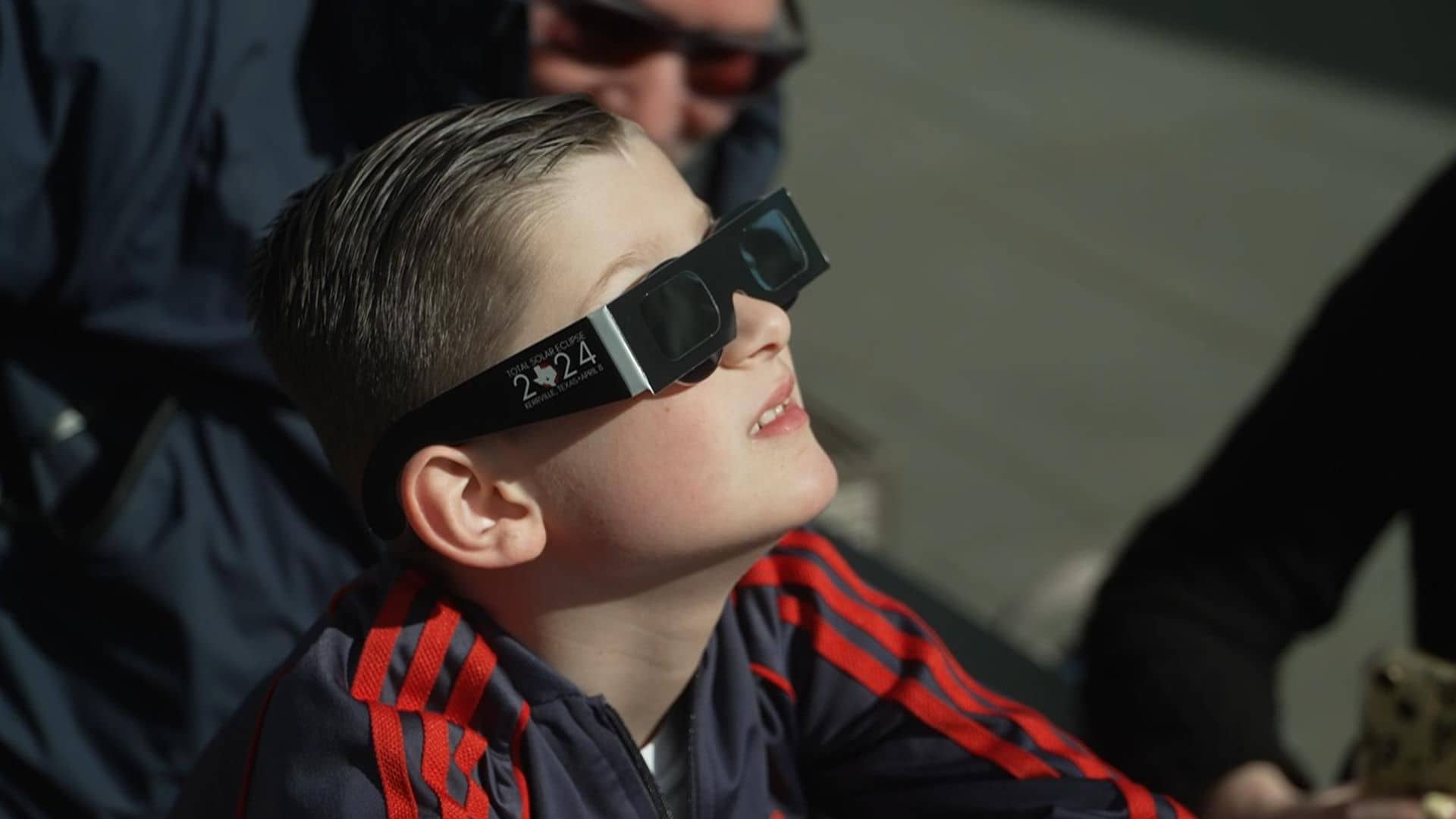 Eclipse chasers in awe as moon takes a nibble from the sun