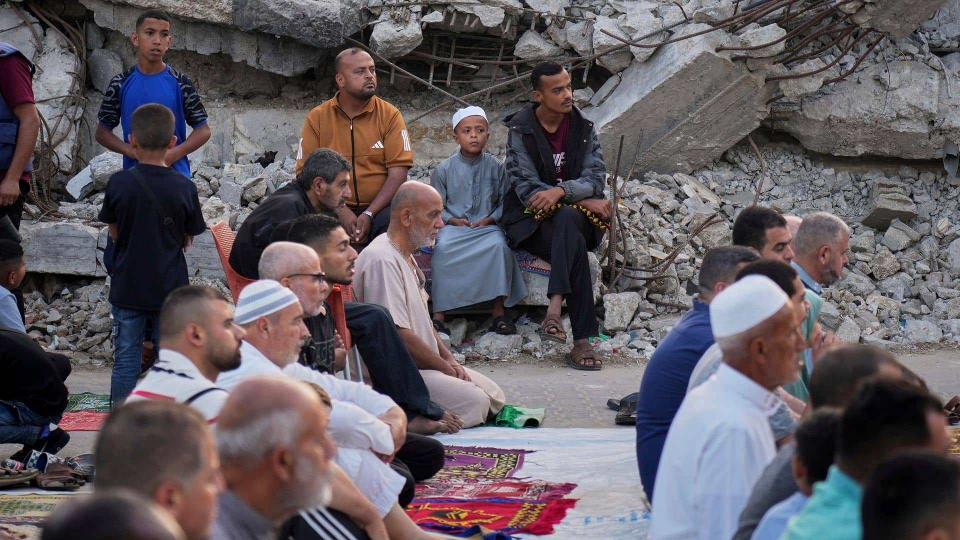 Gazans pray in rubble at start of Eid – as Israel warns of intensive new military operations