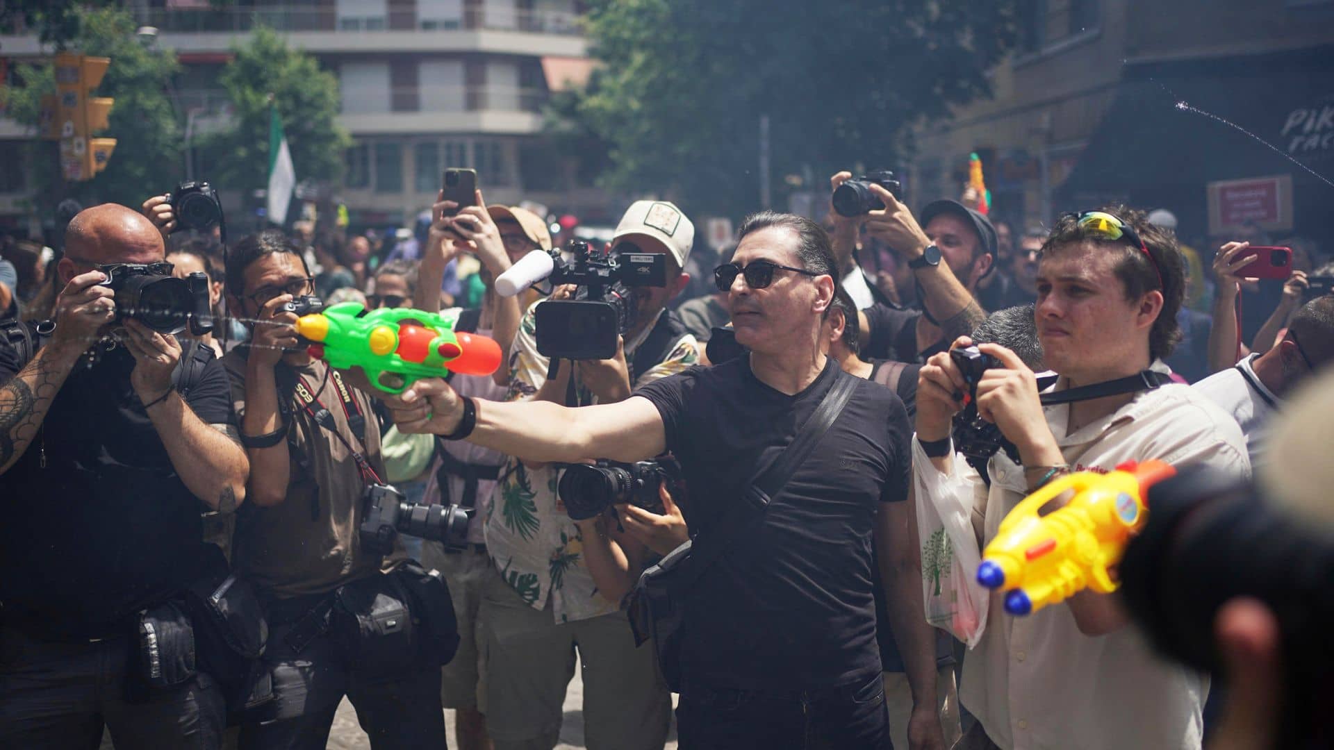Anti-tourism protesters – some armed with water pistols – call for change in Europe’s biggest hotspots